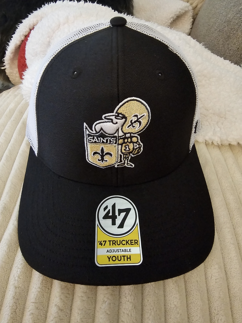 NFL Youth Trucker Cap in Black and White with Gold Saints Logo
